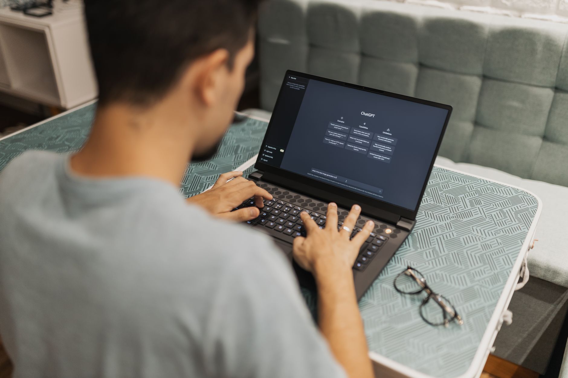 Woman working at a laptop, choosing an AI tool for her work