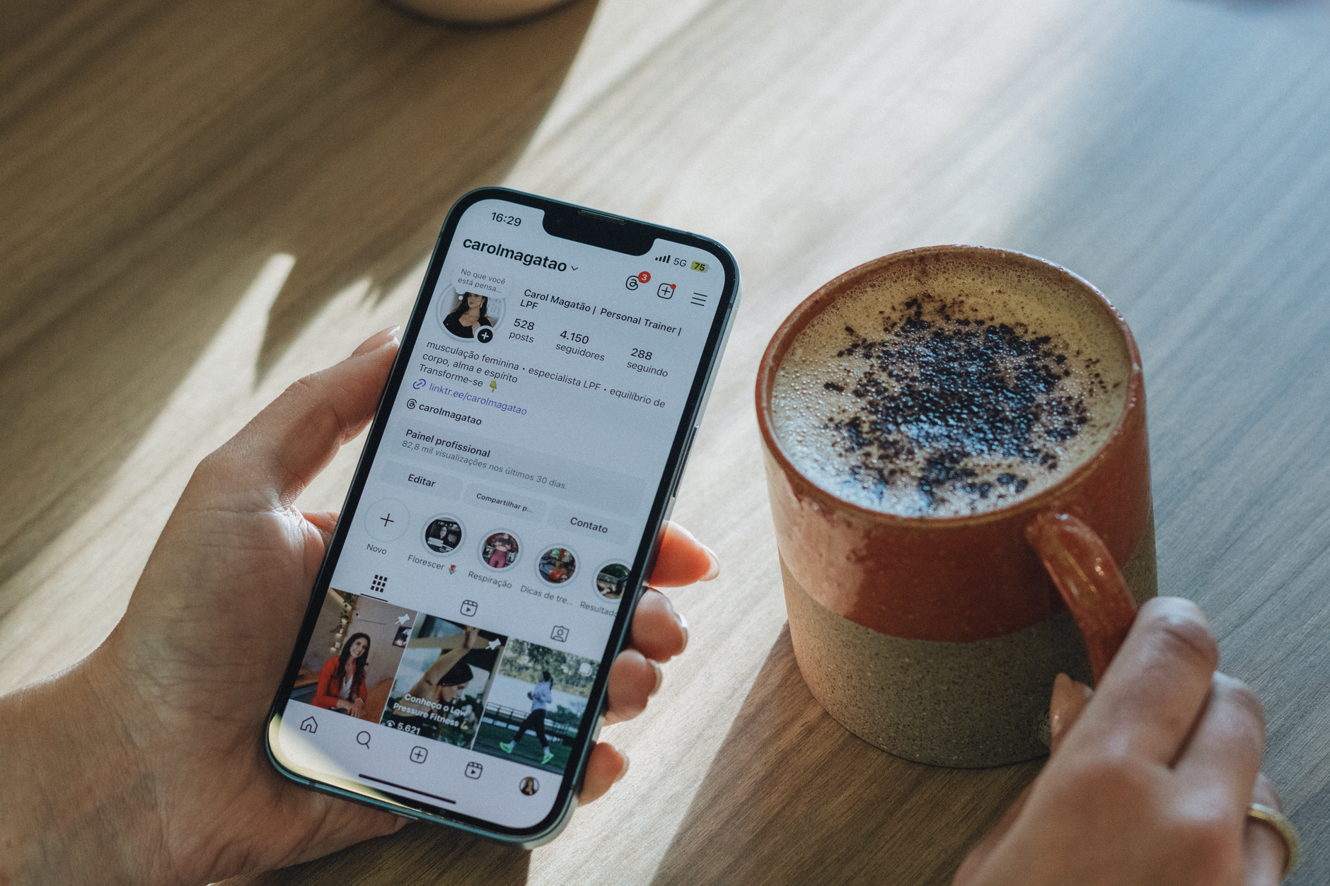 Phone with a notification on a table next to coffee, as an example of scheduling ChatGPT tasks